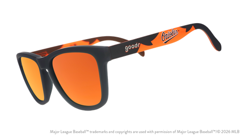Three-quarter angle view of a pair of black and orange sunglasses featuring the Orioles script logo on the arm.