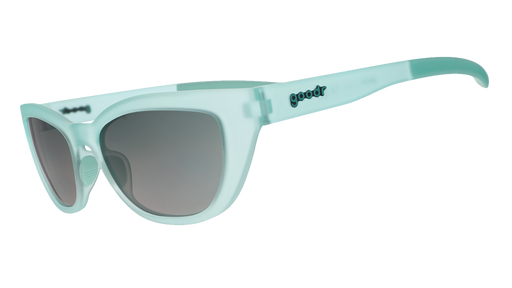 Three-quarter angle view of translucent pale green Cheetah G sunglasses with green gradient lenses.