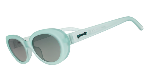 Three-quarter angle view of translucent pale green oval Beat G sunglasses with green gradient lenses.