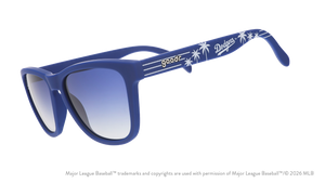 Three-quarter angle view of blue and white Dodgers sunglasses featuring the LA logo and palm trees on the arm.