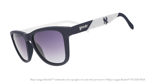 Three-quarter angle view of blue and orange Mets sunglasses featuring the script logo and a New York City skyline on the arm.