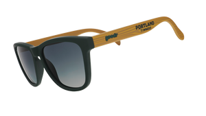 Three-quarter angle view of Portland Timbers Major League Soccer sunglasses with wood-patterned arms and green lenses