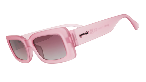 Three-quarter angle view of translucent rectangular pink Luxe G sunglasses with purple gradient lenses.