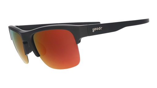Three-quarter angle view of black sunnies with half-rim frames+orange reflective lenses on a white background.
