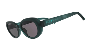 Three-quarter-angle view of translucent dark green Beat G sunglasses with black non-reflective lenses. 