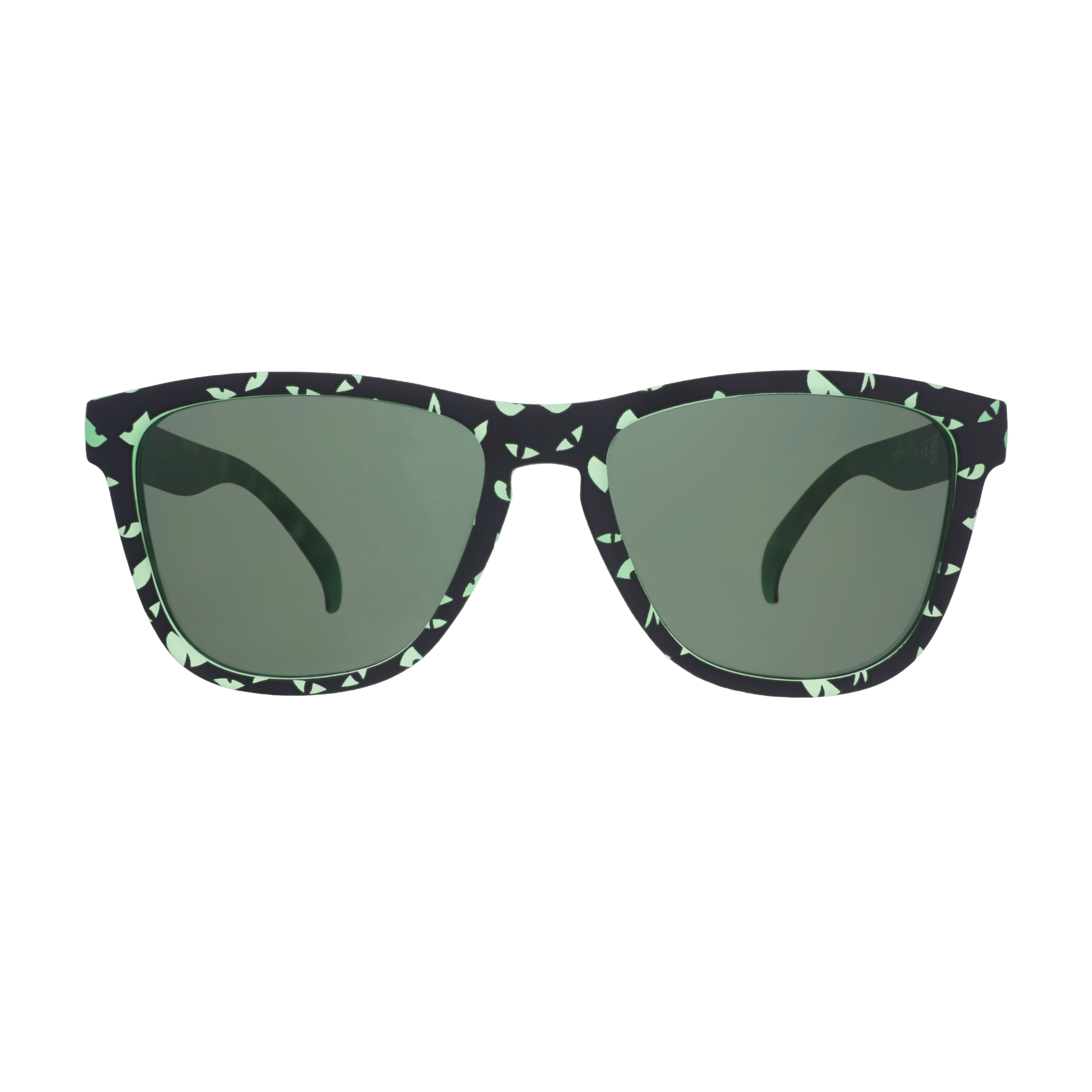Three-quarter view of green-and-black sunglasses with an eerie glowing eyes design and non-reflective green lenses.