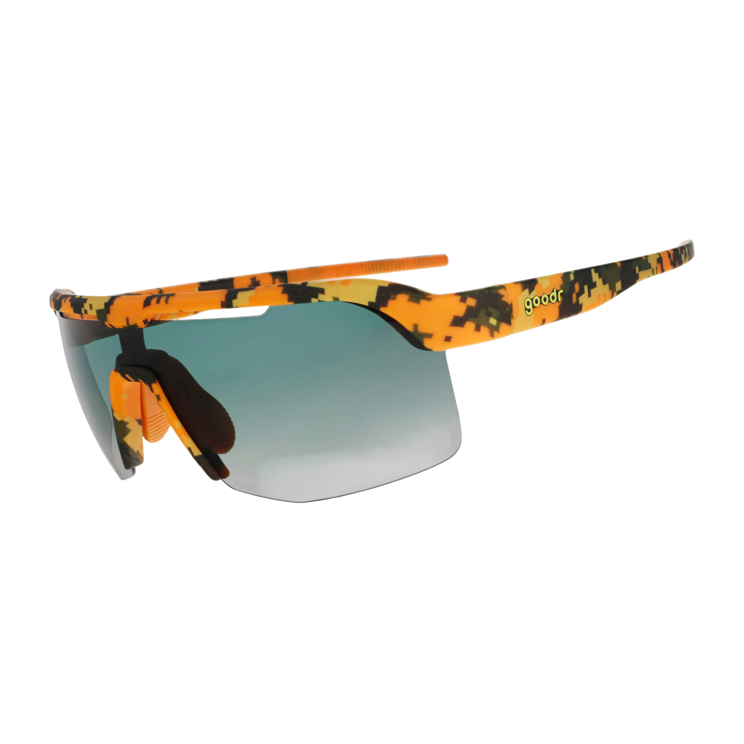 Sport sunglasses with a vibrant orange, yellow, and black camouflage pattern on the frame and arms, featuring a green-to-gray gradient lens and a small green 'goodr' text logo on the temple.