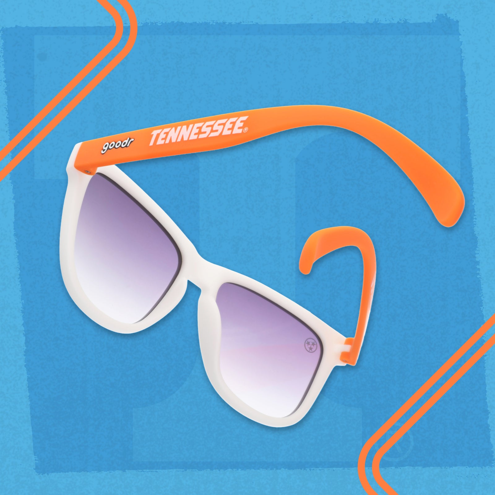 Angled view of Tennessee Volunteers goodr sunglasses with a white frame, orange arms, and black gradient lenses.